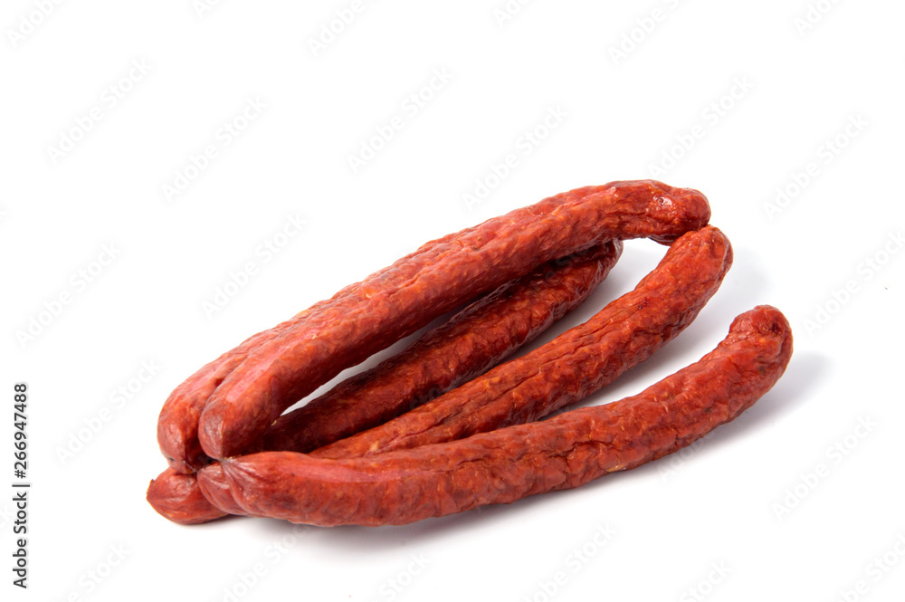 Small smoked sausages isolated on a white background. Small smoked sausages isolated on a white background.
