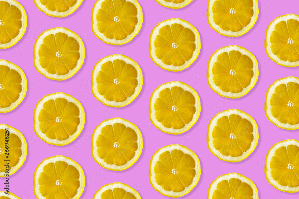Creative pattern made of lemon. top view of fruit fresh limes slices on pink colorful background. Creative pattern made of lemon. top view of fruit fresh limes slices on pink colorful background.