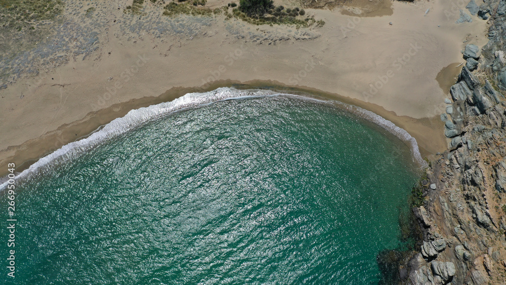 Aerial drone photo of famous beach of Kolympithres with deep turquoise sea, Tinos island, Cyclades, Greece