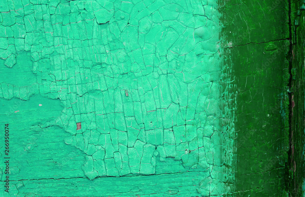 Obraz premium Old wooden background with remains of pieces of scraps of old paint on wood. Texture of an old tree, vintage wood background peeling paint. old blue board with cracked paint