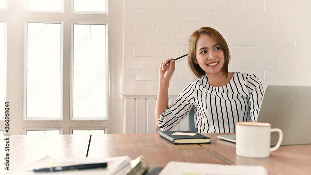 Working women looking a camera shot on office workplace. Working women looking a camera shot on office workplace.