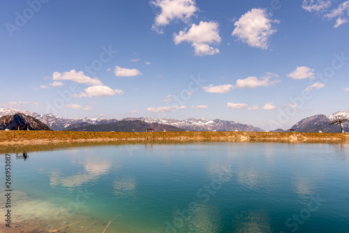 The magical panorama of the alpine lake and the Bavarian mountains, unusually clear, crystalline water reflect the colors of the sky and the forest