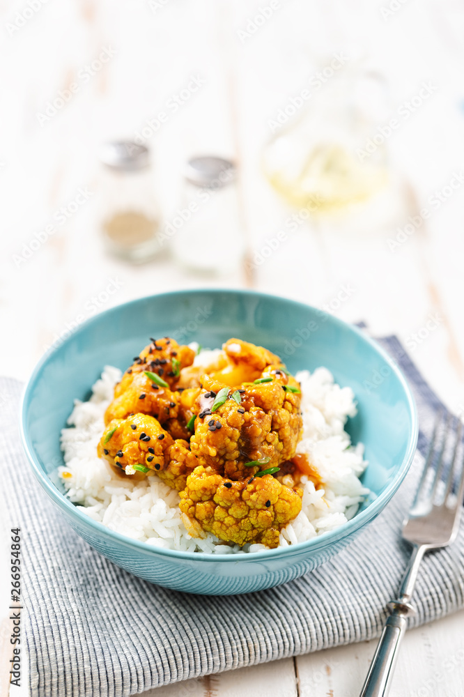 Cauliflower teriyaki with herbs and spices on plate Cauliflower teriyaki with herbs and spices on plate