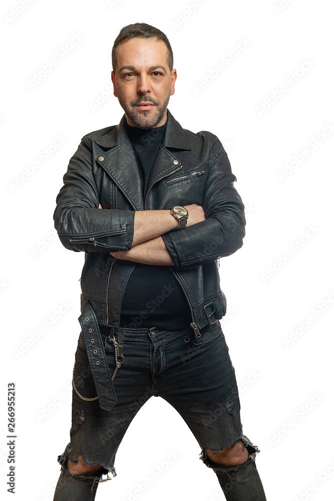 A man in black leather jacket with crossed arms looks into the camera A man in black leather jacket with crossed arms looks into the camera