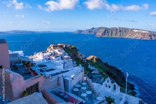 Santorini landscape with traditional whitewashed houses and view of Aegean Sea in Oia, Greece