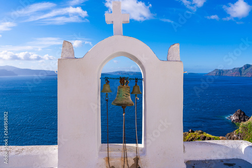 aegean; architecture; aspronisi; beach; beautiful; bell; blue; building; caldera; catholic; chapel; church; cliff; cross; cyclades; destination; dome; europe; fira; greece; greek; hill; holidays; hous photo