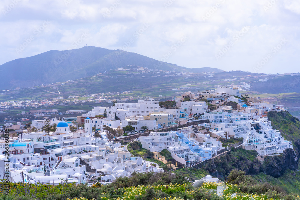 View of Fira with whitewashed houses, the capital of Greek island  Santorini.