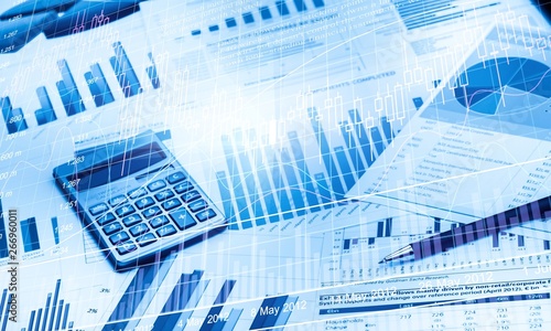 Pen and Calculator on Business Graphs and Charts