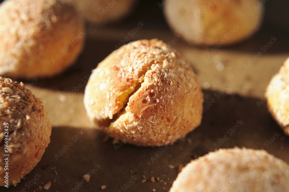 Close-up of a baked bun with side solar lighting. Fresh cottage cheese bread for healthy eating at home recipe