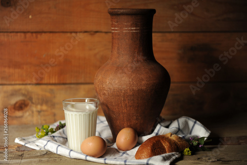 Still life with milk, bread and eggs