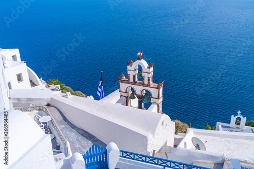 Traditional old Bell Tower against blue sea in Oia, Santorini, Greece