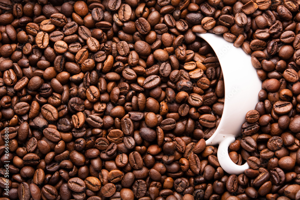 Fototapeta premium white cup of coffee beans top view