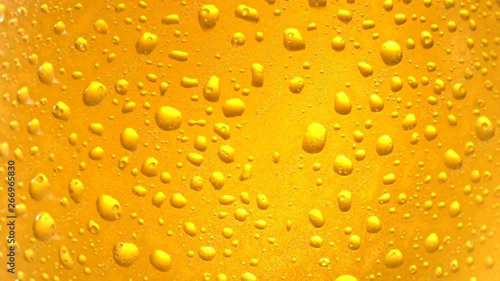 Close up of cold beer with drops and bubbles. Close up of cold beer with drops and bubbles.