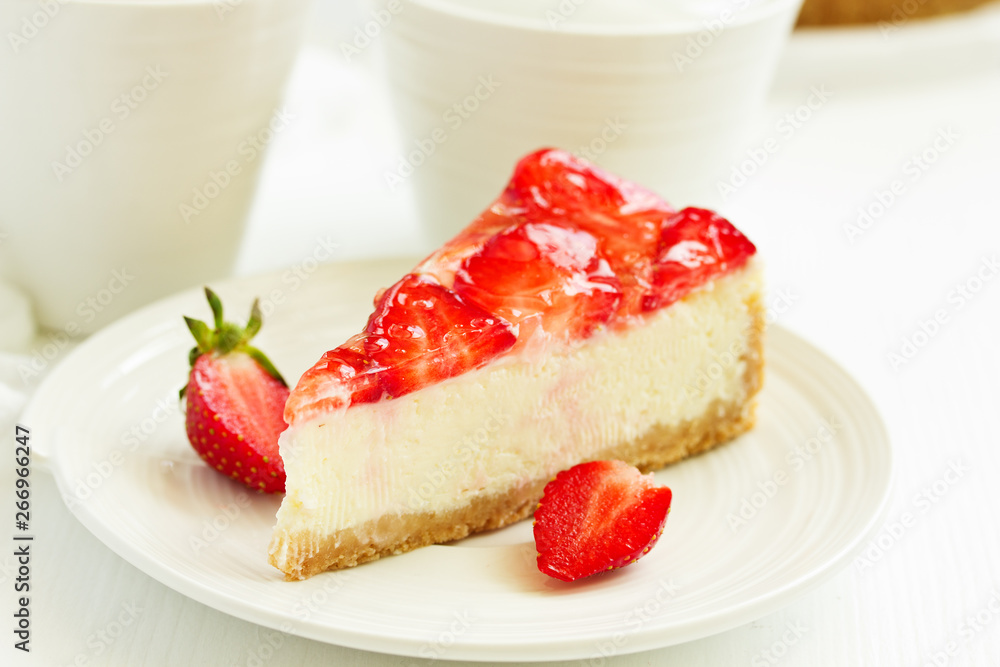 Classic cheesecake with fresh strawberries. Selective focus. Classic cheesecake with fresh strawberries. Selective focus.