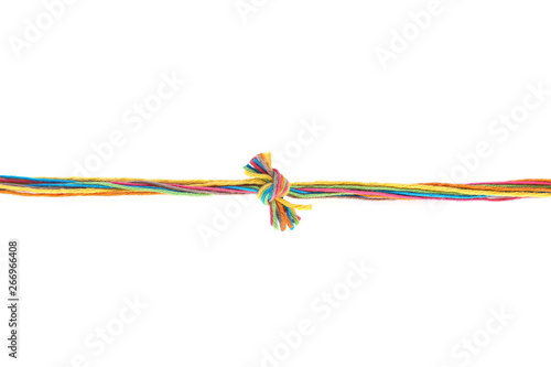 Colorful knot of cotton thread isolated on white background. Thread line with knot made of different color pink, green, yellow, blue, orange thread mix.