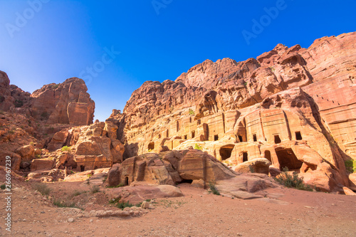 Caves in sandstones, columns and ruins of the ancient Bedouin city of Petra, Jordan