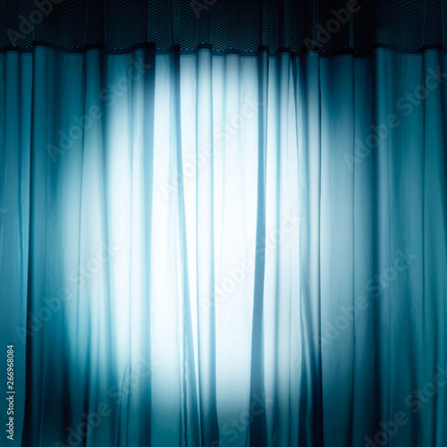 Blue curtain with spotlight