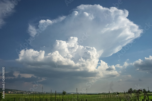Wide angle view of a thunderstorm with rain shaft and anvil