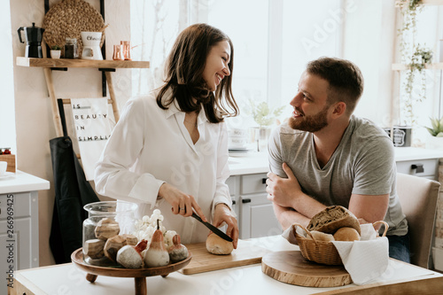 Romantic young couple cooking together in the kitchen,having a great time together.