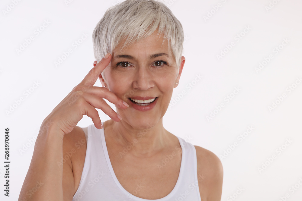 Happy Smiling Mature Woman Portrait on white background. Older skin care, Anti-aging and Beauty concept. Happy Smiling Mature Woman Portrait on white background. Older skin care, Anti-aging and Beauty concept.