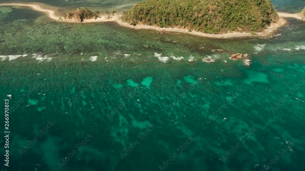 Aerial drone tropical island in blue lagoon, coral reef and big wave. Palawan, Philippines. tropical landscape ,travel concept Aerial drone tropical island in blue lagoon, coral reef and big wave. Palawan, Philippines. tropical landscape ,travel concept