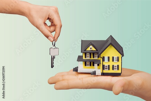 Hand giving set of house keys