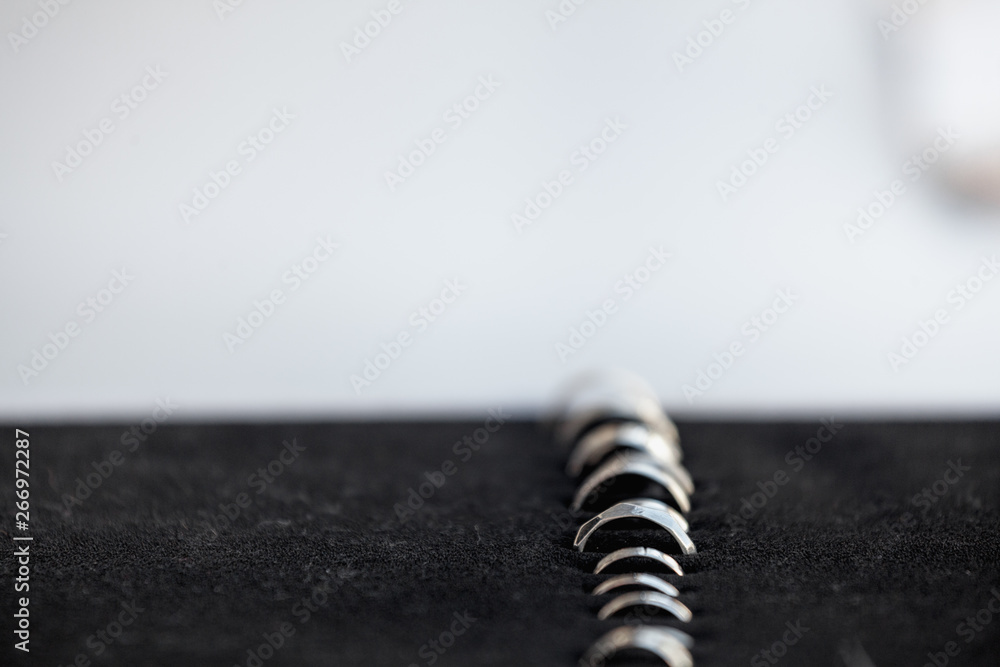 handmade silver rings in black case on the table handmade silver rings in black case on the table