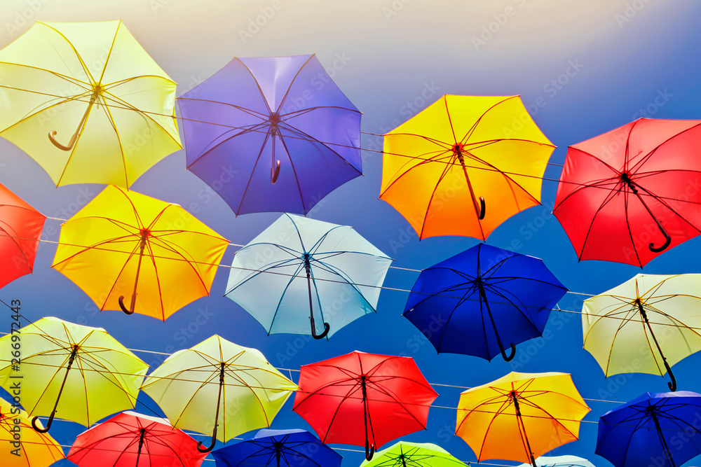 Colorful umbrellas on the sky background. Colorful umbrellas on the sky background.