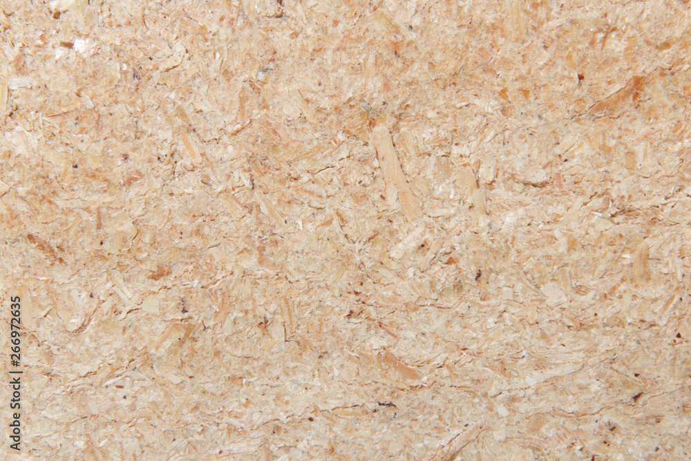 Background from a freshly cut brown sawdust Background from a freshly cut brown sawdust
