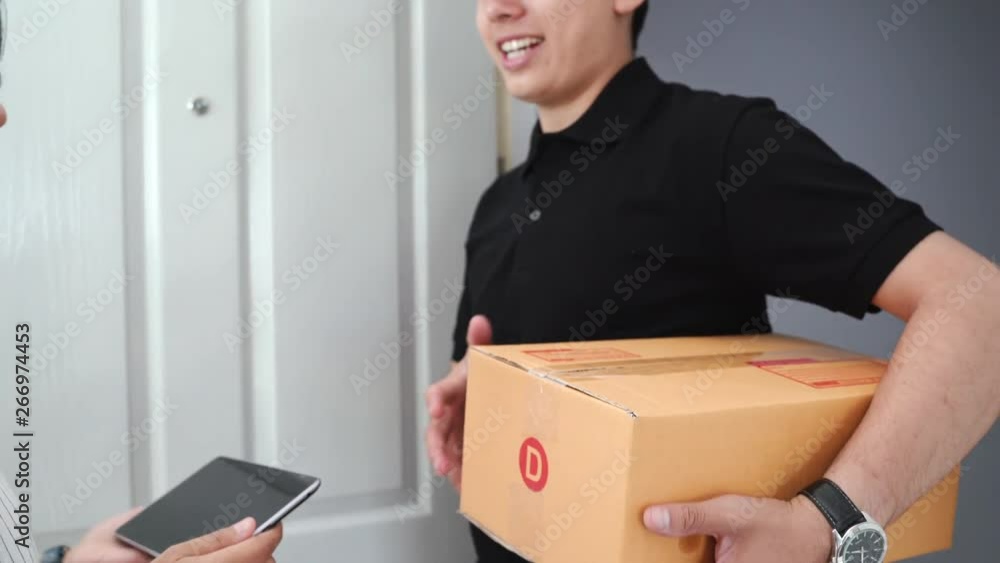 Delivery worker man delivers packages at apartment Delivery worker man delivers packages at apartment