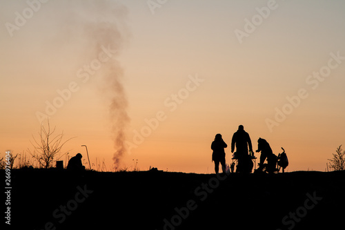 silhouette of people at sunset © Viktor