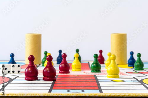 parcheesi game set upon board with white background photo