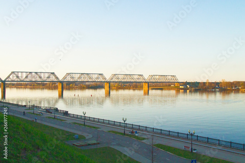 eliable large long bridge across a wide river, spring time