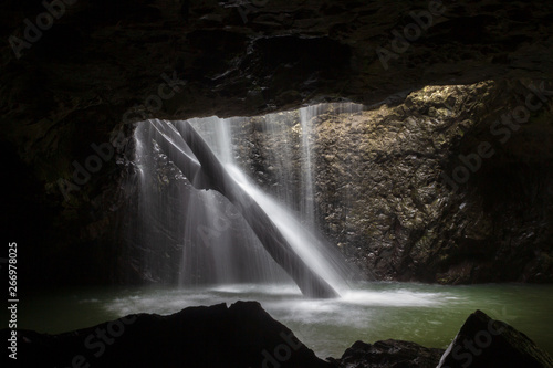 The Natural Bridge waterfall at Springbrook National Park. Its also known as a glow worm cave  Queensland Australia