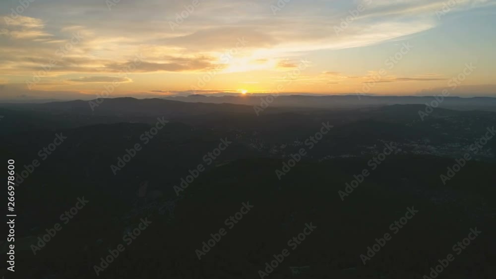 Flying back slowly over mountains. Beautiful view of clouds and amazing golden hour sunset. Aerial cinematic 4K drone footage Flying back slowly over mountains. Beautiful view of clouds and amazing golden hour sunset. Aerial cinematic 4K drone footage