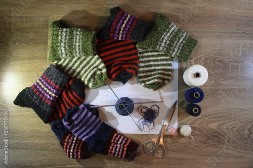 socks wool, woolen , material and fabrics,thread, scissors and stone , needles , andres for woven