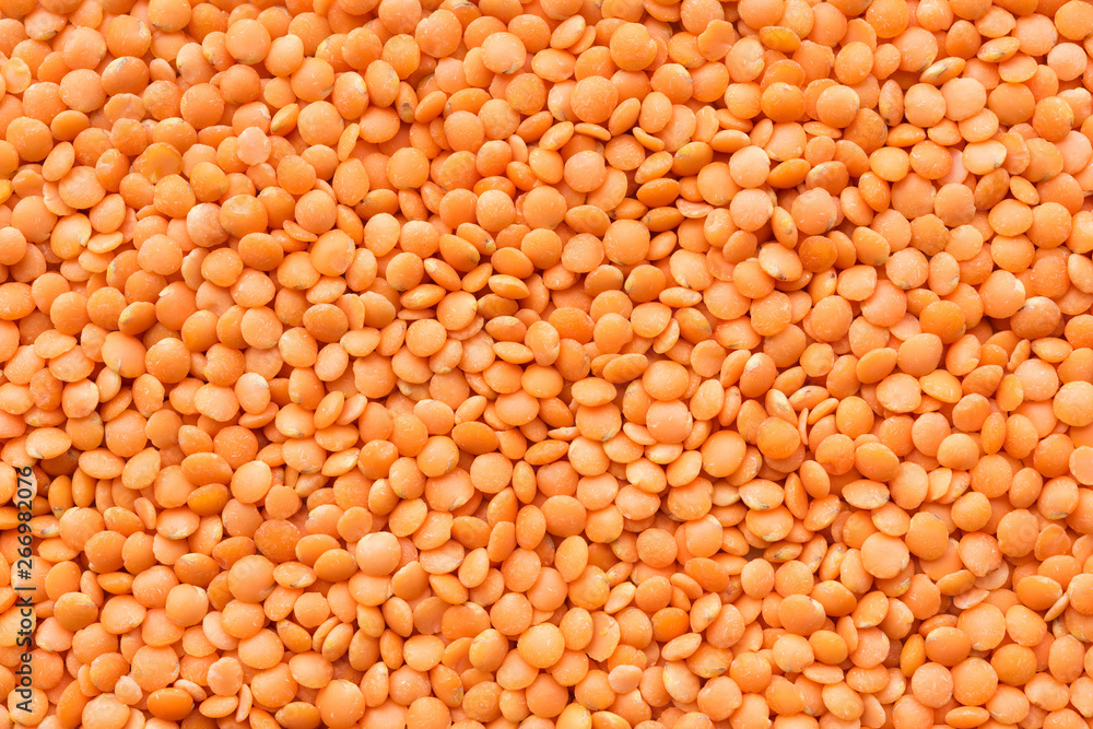 Background with a lot of red lentils.