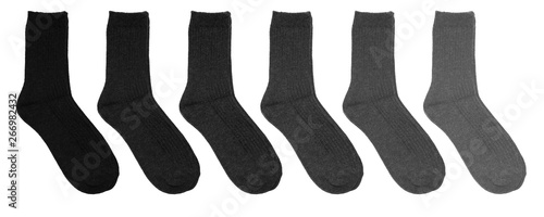 Grey socks of different colors. Socks in a row on a white background. Gray socks on a white background.