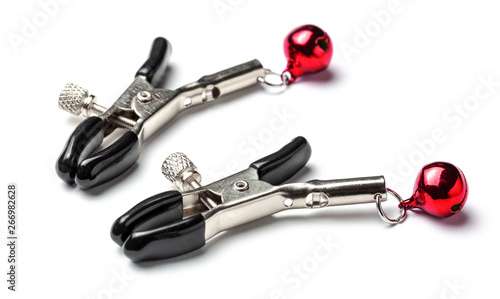 Schilderij op canvas Nipple clamps made of metal with red bells