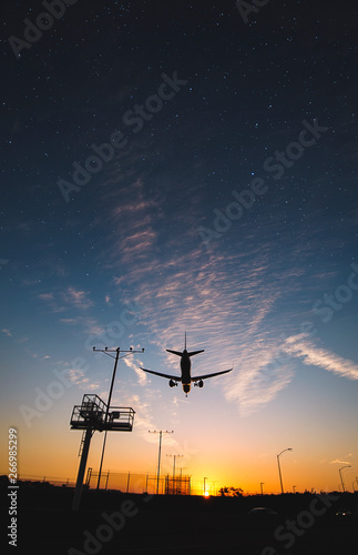  Plane Touching Down at Sunset