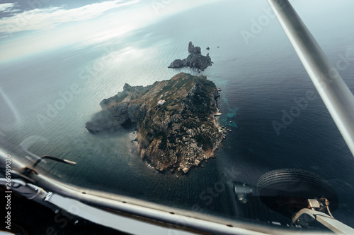 Aerial view on some islands from the inside of a small plane photo