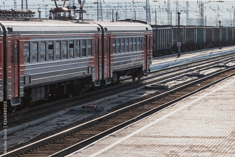 Train stands on railroad tracks. Train for intercity passenger traffic.