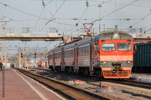 Train stands on railroad tracks. Train for intercity passenger traffic.