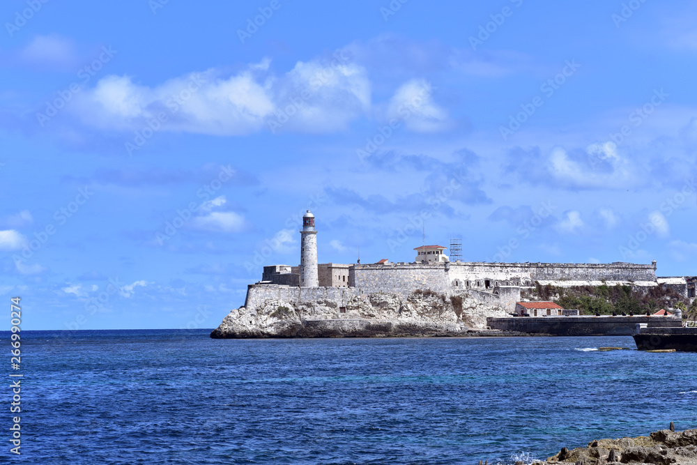 View of El Morro the fort overlooking the entrance to Havana Harbor from the sea wall along Havana, Cuba