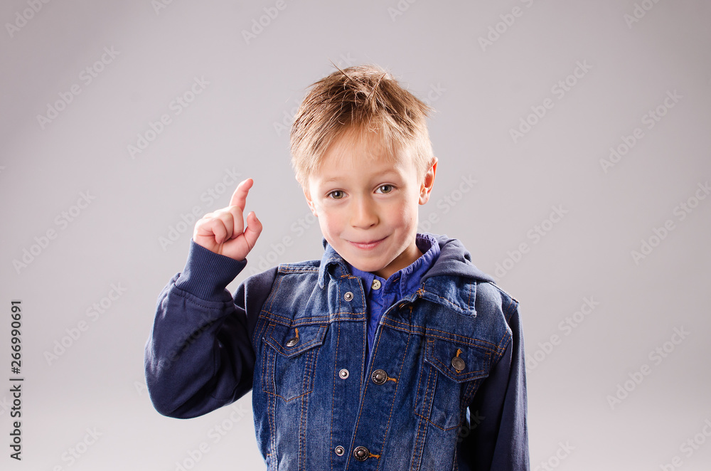 Little boy with raised finger Little boy with raised finger