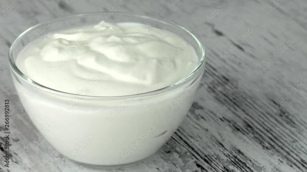 A group of environmentally friendly non-GMO dairy products, yogurt, cottage cheese, sour cream and cheese on the bottom of the pod. A group of environmentally friendly non-GMO dairy products, yogurt, cottage cheese, sour cream and cheese on the bottom of the pod.
