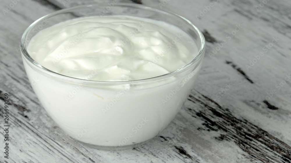 A group of environmentally friendly non-GMO dairy products, yogurt, cottage cheese, sour cream and cheese on the bottom of the pod. A group of environmentally friendly non-GMO dairy products, yogurt, cottage cheese, sour cream and cheese on the bottom of the pod.