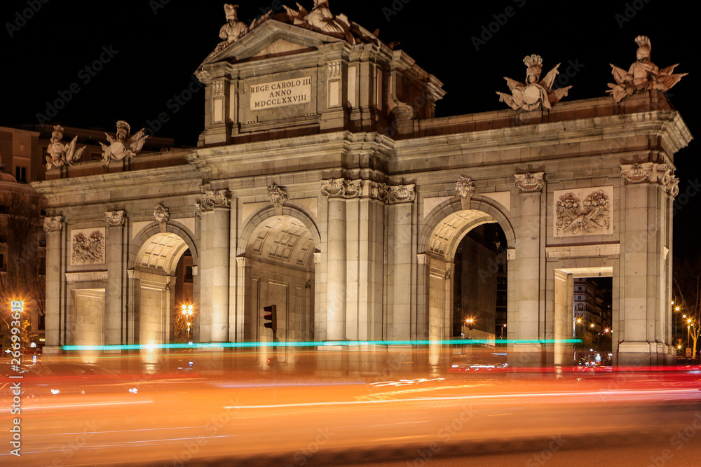 City lights throught Alcala gate in Madrid by night