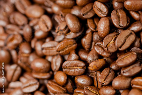 Freshly ground coffee beans roasted with the fruits of the coffee plant, full of grains.