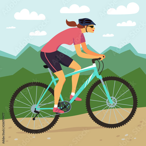  Fast mountain woman biker and mountain landscape.